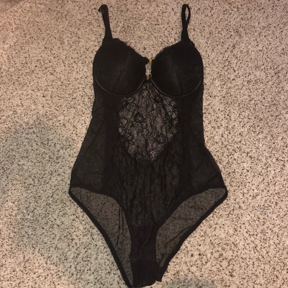 Intricate black lace lingerie bodysuit